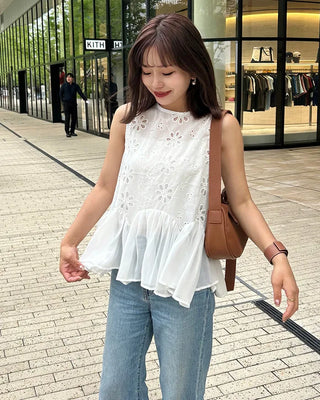 Perforated ruffle sleeveless top