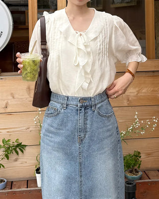 Pintuck ruffle bow tie blouse
