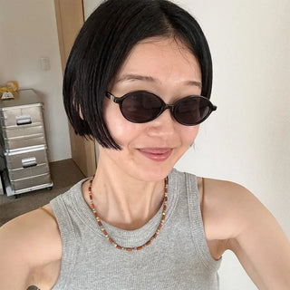 Tinted oval sunglasses