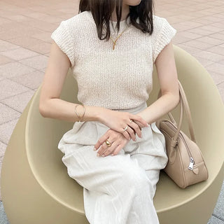 Sleeveless mock neck knit