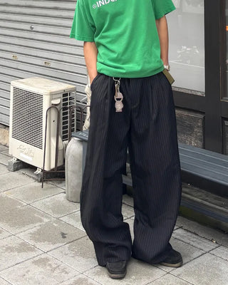 Double-pleated striped slacks