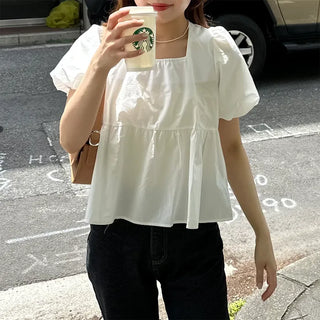 Voluminous peplum blouse