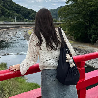 Drawstring pocket shoulder bag