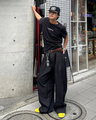 Double-pleated striped slacks