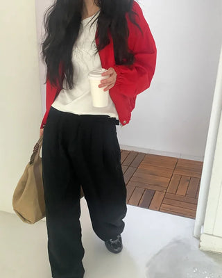 Wide-leg pants with buckle pleats