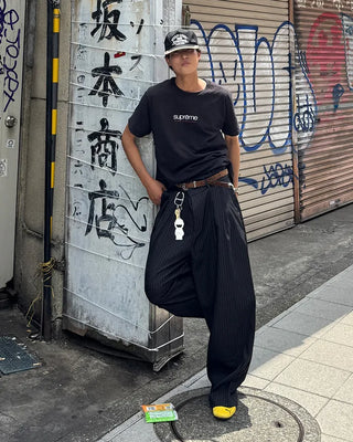 Double-pleated striped slacks