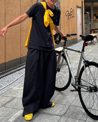 Double-pleated striped slacks