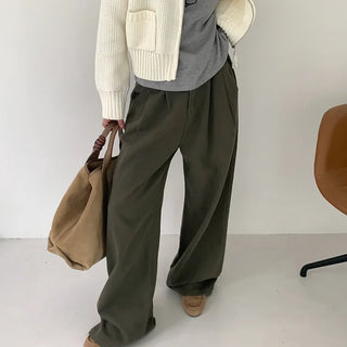 Wide-leg pants with buckle pleats