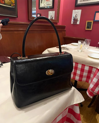 One-button leather handbag