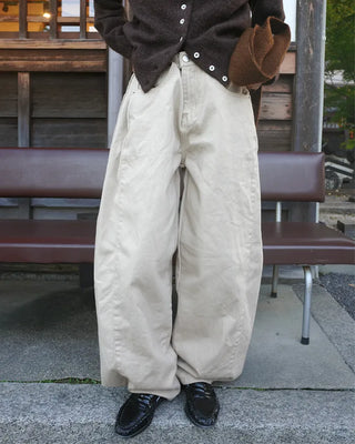 Side-tucked white cotton pants