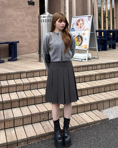 Belted pleated midi skirt