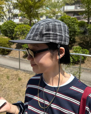 Checkered cap with drawstring