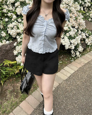 Frilled hem sleeveless blouse