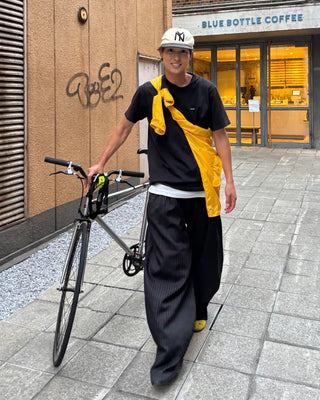 Double-pleated striped slacks