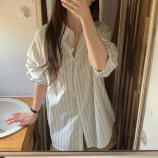 Loose-fit cotton striped shirt (2c)
