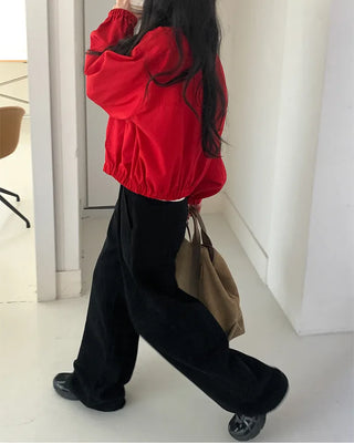 Wide-leg pants with buckle pleats