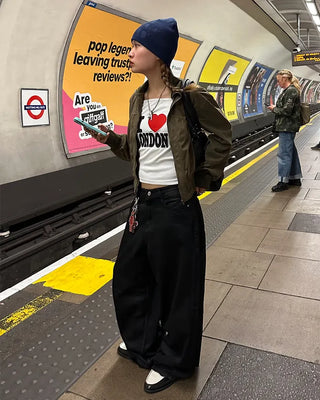 Coated black baggy denim pants