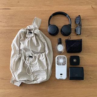 Drawstring pocket shoulder bag