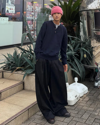 Double-pleated striped slacks