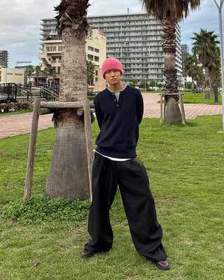 Double-pleated striped slacks