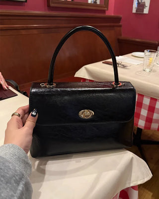 One-button leather handbag