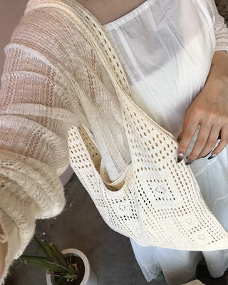 Perforated knit shoulder bag