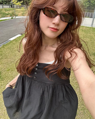Back-button sleeveless blouse