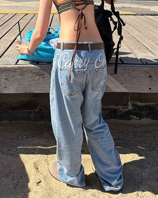 Back lettering denim pants