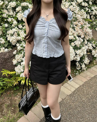 Frilled hem sleeveless blouse