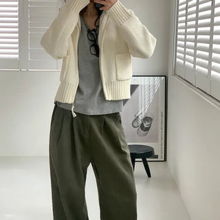 Wide-leg pants with buckle pleats