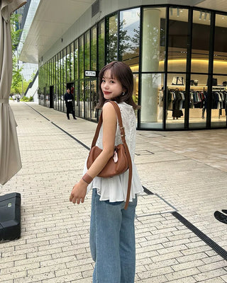Perforated ruffle sleeveless top