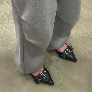 Belted pointed flat shoes