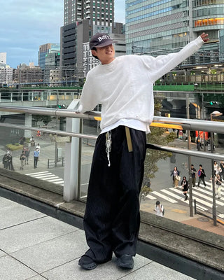 Double-pleated striped slacks