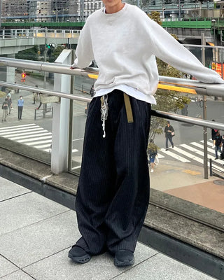 Double-pleated striped slacks