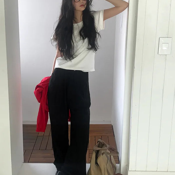 Wide-leg pants with buckle pleats