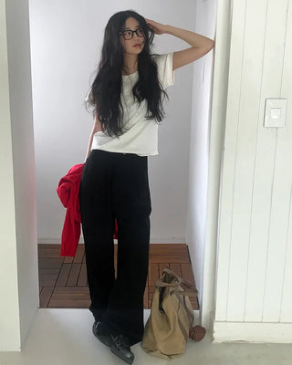 Wide-leg pants with buckle pleats