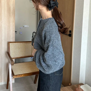 Loose-fitting button-up wool cardigan