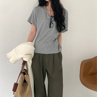 Wide-leg pants with buckle pleats