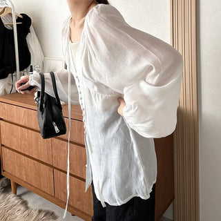 Deep V-neck sheer blouse