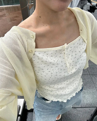 Sleeveless dress with ruffled hem and buttons