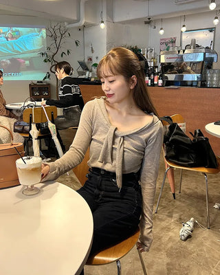 Tie-off shoulder knit