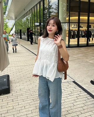 Perforated ruffle sleeveless top