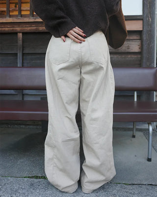 Side-tucked white cotton pants