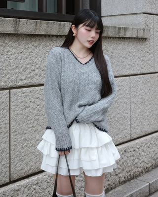 V-neck two-tone cable knit sweater