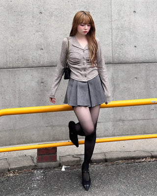 Belted pleated mini skirt