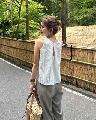 Sleeveless top with back slit