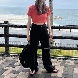 Distressed black denim pants
