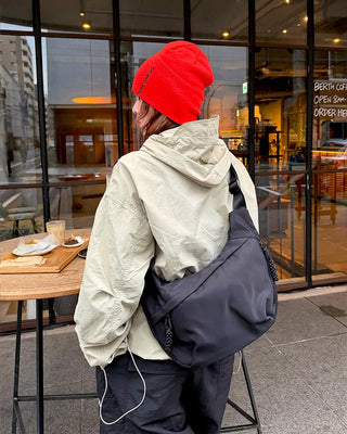 Hooded windbreaker with pockets