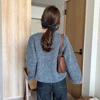 Loose-fitting button-up wool cardigan
