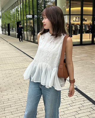 Perforated ruffle sleeveless top
